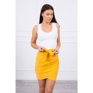 Wrap skirt tied at the waist with mustard