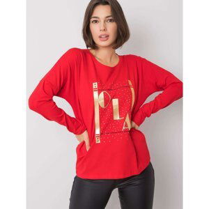 Women´s red blouse with an application
