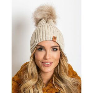 Beige hat with a pompom