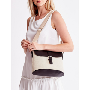 A beige and black fabric bag with a flap