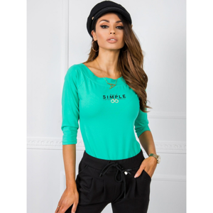 Green blouse with a boat neckline