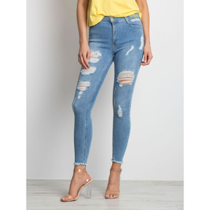 Distressed blue denim skinny jeans