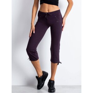 Women´s dark purple capri sweatpants with an application of rhinestones