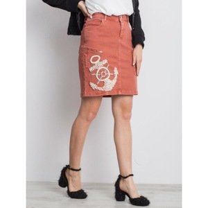 Dark orange denim skirt with an application