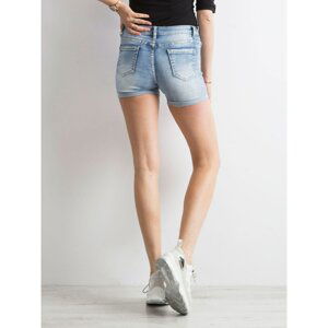 Blue denim shorts with patches