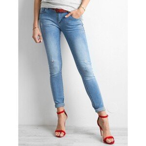 Women's worn blue jeans