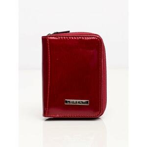 A small burgundy leather wallet