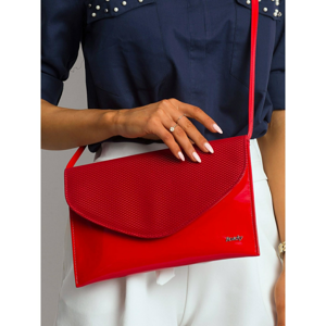 Lacquered clutch bag with a detachable red strap