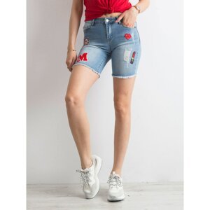 Blue denim shorts with patches