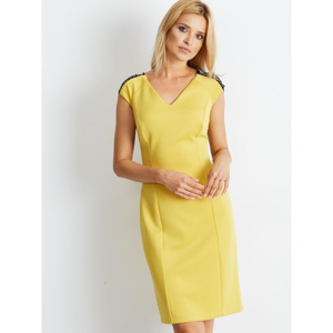 Women´s yellow dress with decorative chains