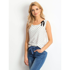 White polka dot top with a bow