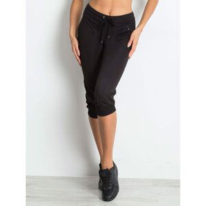 Black capri pants with cuffs on the legs