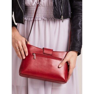 Small red leather handbag with a magnet