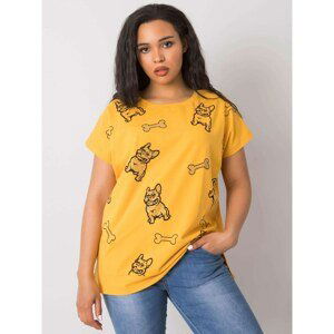 Yellow women's blouse with a print and an application