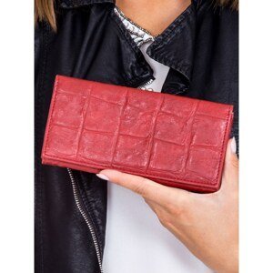 A dark red wallet with an embossed crocodile skin motif