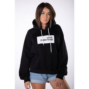 oversize sweatshirt with a hood and a badge