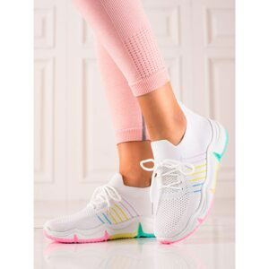 TRENDI SPORTS SHOES ON A COLORFUL PLATFORM