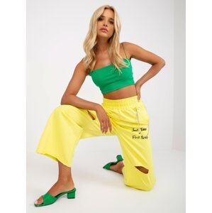 Yellow wide sweatpants with inscriptions