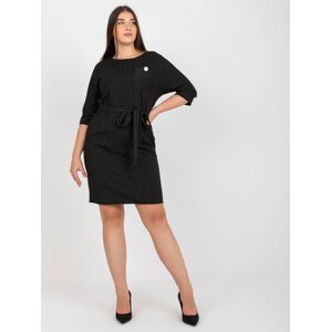 Black pencil dress of larger size with a detail for tying