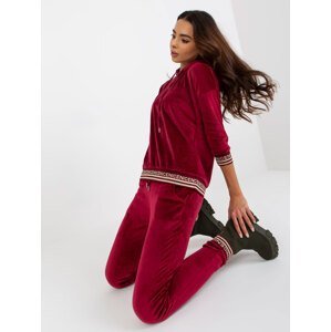Burgundy two-piece velour set with trousers