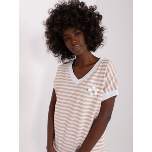 Lady's white-beige striped blouse with brooch