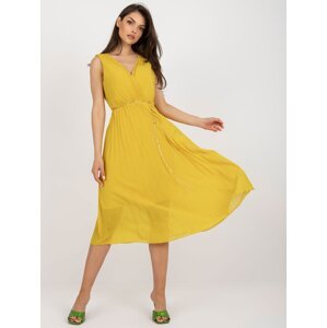 Dark yellow flowing dress with pleats