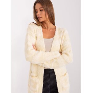 Light beige delicate women's cardigan with patterns