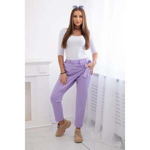 Trousers tied with an asymmetrical light purple front