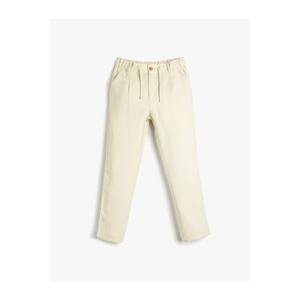 Koton Trousers with a tie waist and elasticated pockets, and skinny legs.