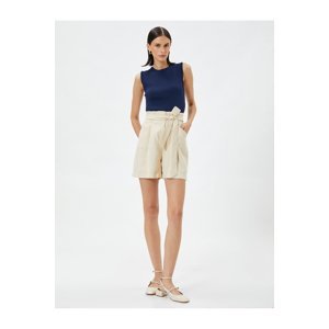 Koton Silky-textured shorts with a belt and pockets.