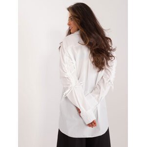 Long white shirt with cuffs on the sleeves
