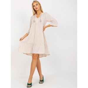 Light beige oversize dress with ruffle and 3/4 sleeves