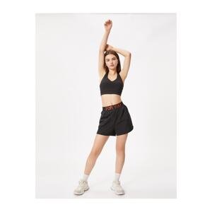 Koton Sports Tights Shorts. The slogan is Embroidered.