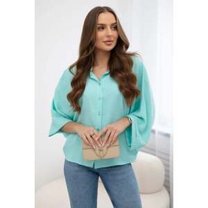 Mint-colored oversized blouse with button closure