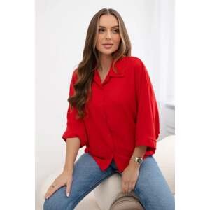 Oversized blouse with red button fastening