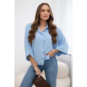 Oversized blouse with blue button fastening