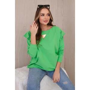 Cotton blouse with ruffles on the shoulders in light green color