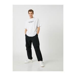 Koton Parachute Trousers with a loose fit, lacing at the waist, and elasticated legs with a pocket detail.