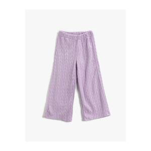 Koton The Wide Leg Trousers have a relaxed fit. The waist is elasticated, textured.