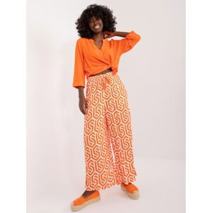 Orange wide trousers with SUBLEVEL print