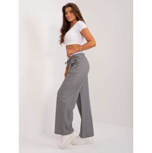 Grey fabric trousers with a white belt