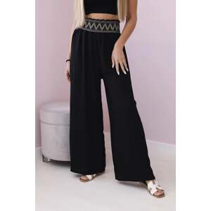 Black trousers with a wide elastic waistband