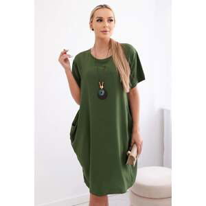 Loose dress with pockets and a pendant, light green