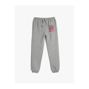 Koton Jogger Sweatpants with Tie Waist and Glitter Print Detail