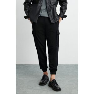 GRIMELANGE Leroy Men's Thick Textured Fabric 6 Pocket Wide Cut Elastic Waist Black Trousers with Velcro Legs