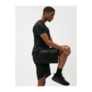 Koton Lace-Up Sports Shorts with Pocket Details with a Slogan Print.